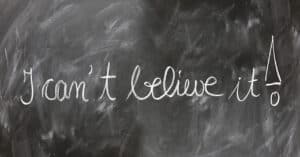 A chalkboard in a classroom saying I can't believe it